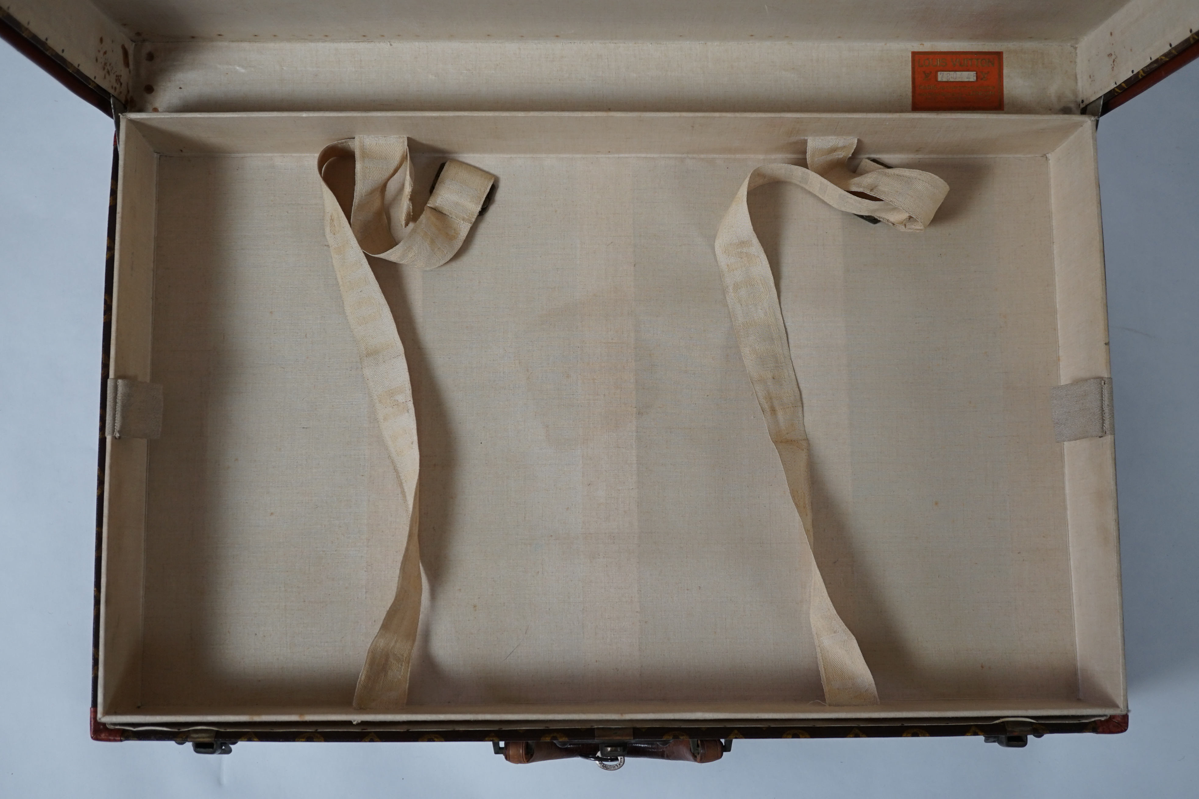 A vintage Louis Vuitton monogram canvas suitcase, 71cm x 44cm x 22cm